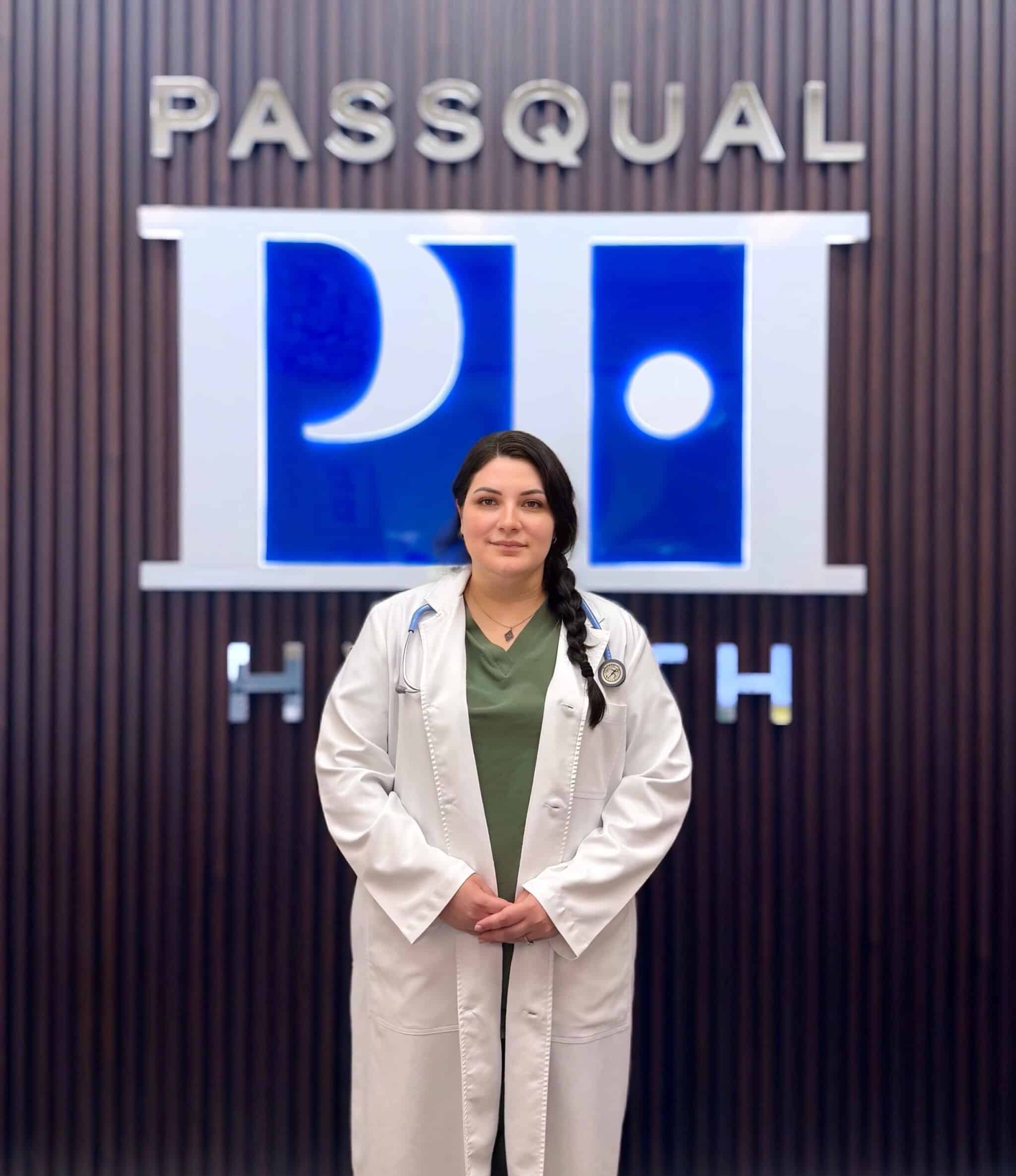 Portrait of Jessica Herrera, APRN, Primary Care Provider at PassQual Health, wearing a white coat